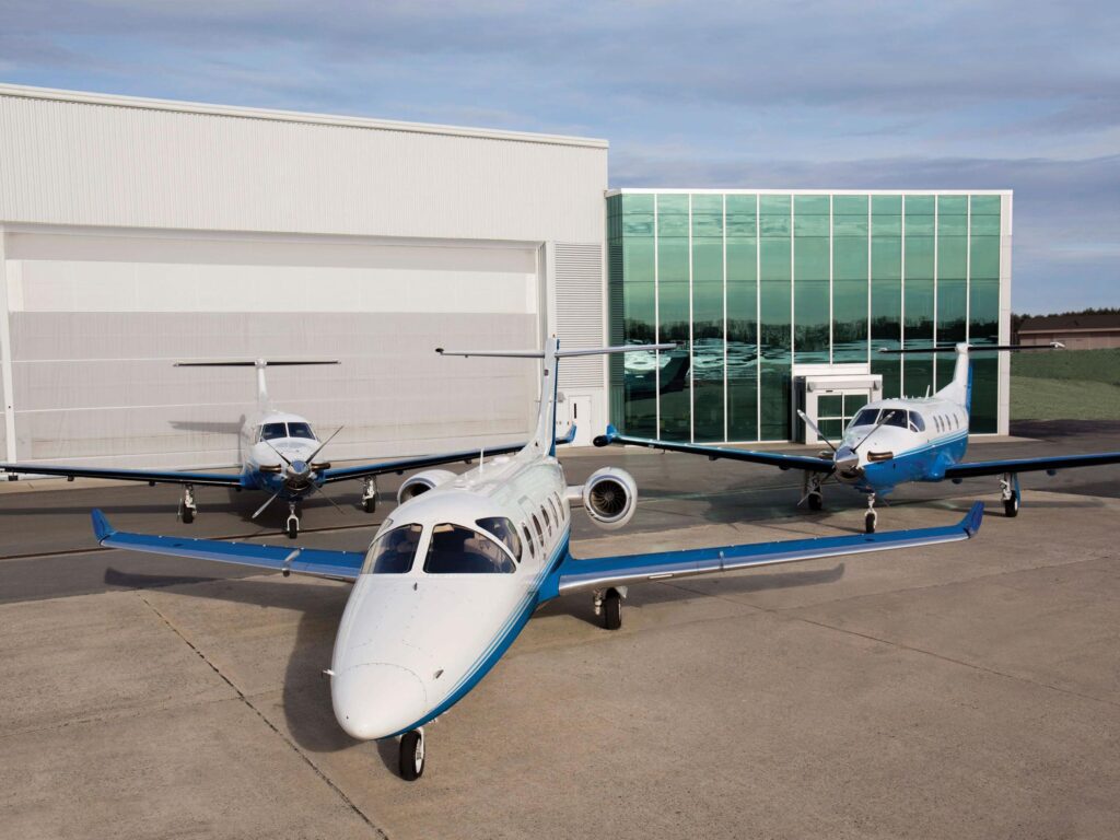 Three Pilatus aircraft stationed outside PlaneSense headquarters in Portsmouth, NH